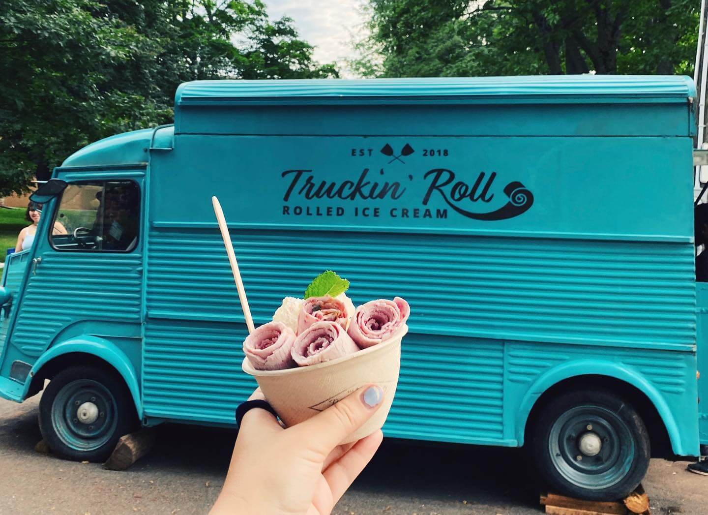 Ice cream served in front of the blue truckin roll truck